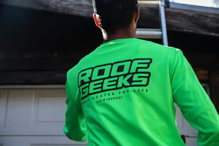 Roof Geeks crew member inspecting a roof